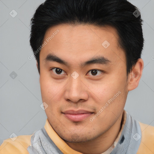 Joyful asian young-adult male with short  brown hair and brown eyes