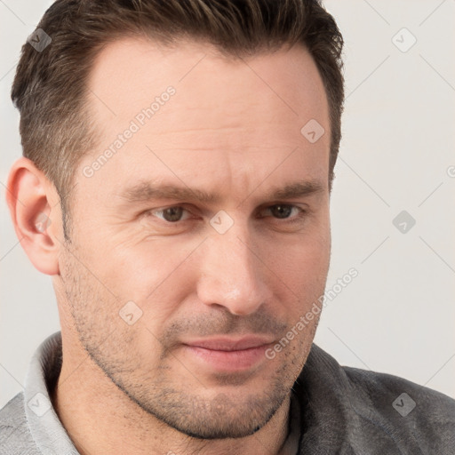 Joyful white adult male with short  brown hair and grey eyes