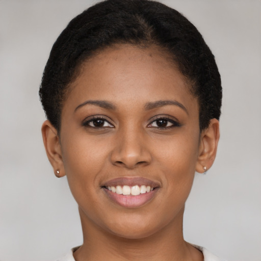 Joyful latino young-adult female with short  brown hair and brown eyes