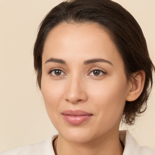 Joyful white young-adult female with medium  brown hair and brown eyes