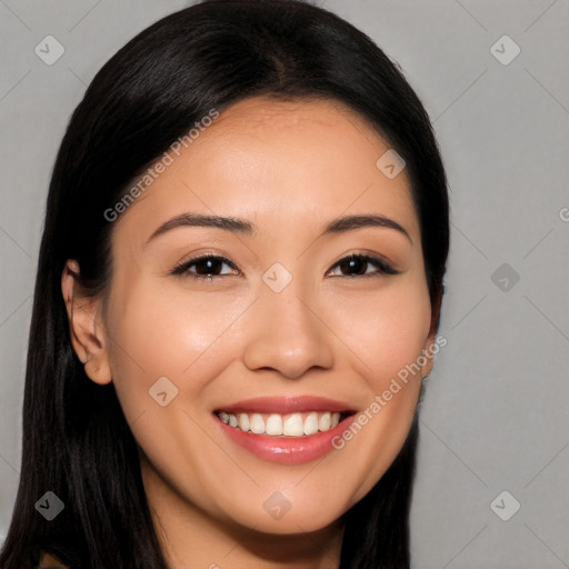 Joyful asian young-adult female with long  brown hair and brown eyes