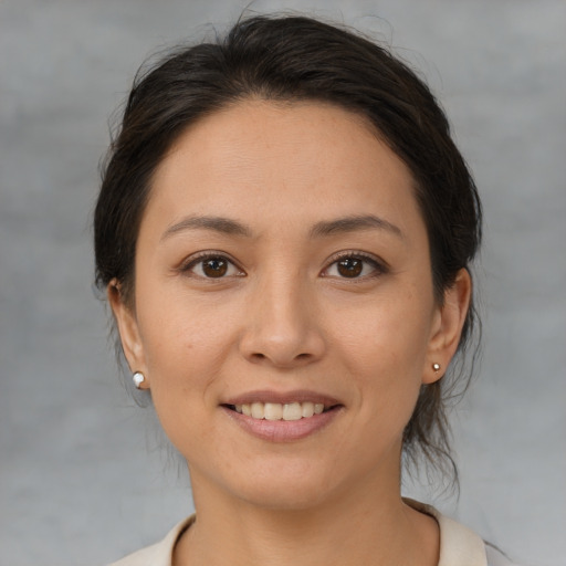 Joyful white young-adult female with medium  brown hair and brown eyes