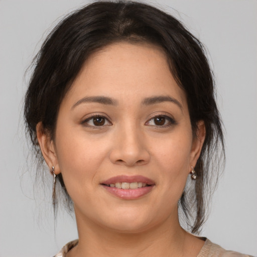 Joyful asian young-adult female with medium  brown hair and brown eyes