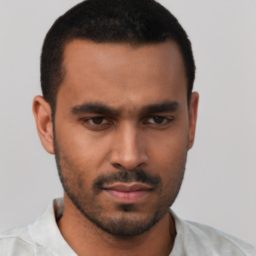 Neutral black young-adult male with short  black hair and brown eyes