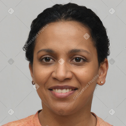 Joyful latino young-adult female with short  brown hair and brown eyes