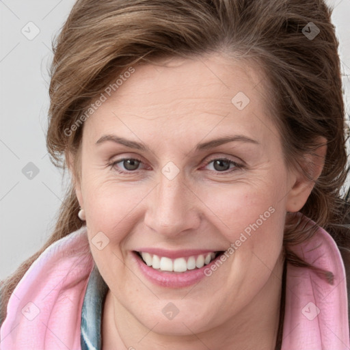 Joyful white young-adult female with medium  brown hair and blue eyes