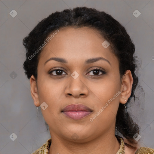 Joyful black young-adult female with long  brown hair and brown eyes