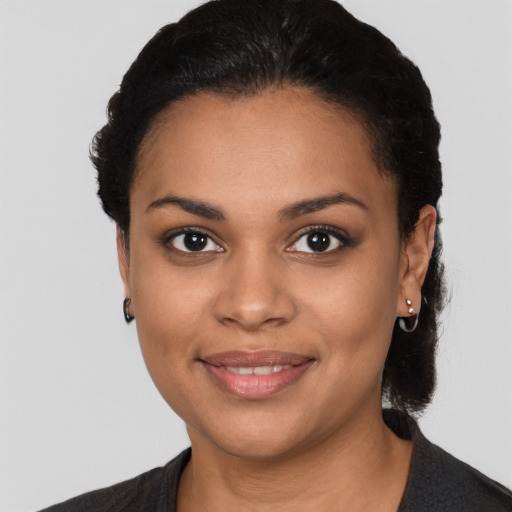 Joyful latino young-adult female with medium  black hair and brown eyes