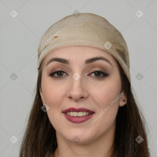 Joyful white young-adult female with long  brown hair and brown eyes