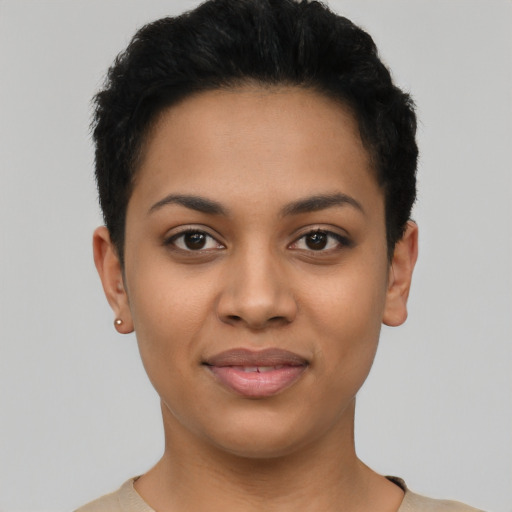 Joyful latino young-adult female with short  black hair and brown eyes