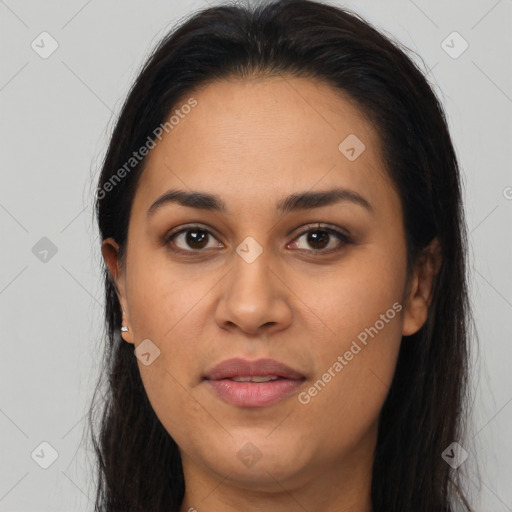 Joyful latino young-adult female with long  brown hair and brown eyes