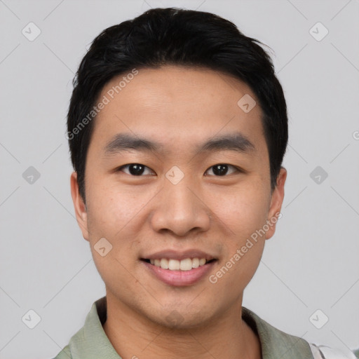 Joyful asian young-adult male with short  black hair and brown eyes