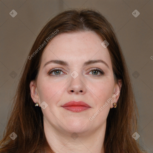 Joyful white adult female with long  brown hair and grey eyes