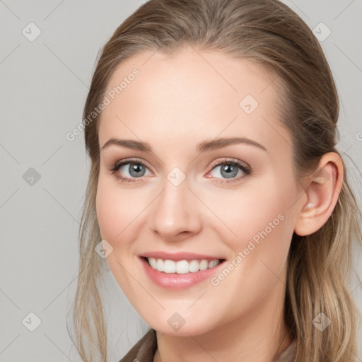 Joyful white young-adult female with long  brown hair and blue eyes