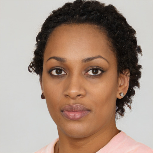 Neutral black young-adult female with short  brown hair and brown eyes