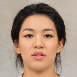 Neutral asian young-adult female with medium  brown hair and brown eyes