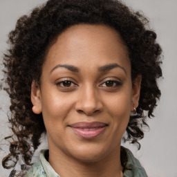 Joyful black young-adult female with medium  brown hair and brown eyes