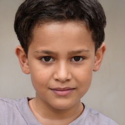 Joyful white child male with short  brown hair and brown eyes