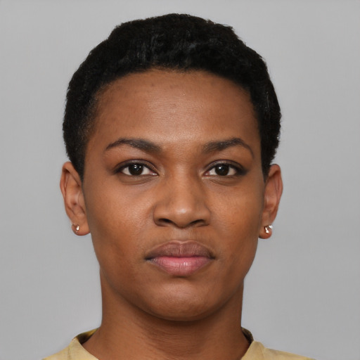 Joyful black young-adult female with short  black hair and brown eyes