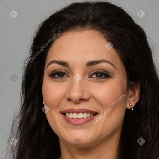 Joyful white adult female with long  brown hair and brown eyes