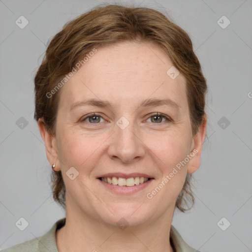 Joyful white adult female with medium  brown hair and grey eyes