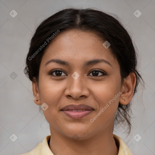 Joyful latino young-adult female with medium  brown hair and brown eyes