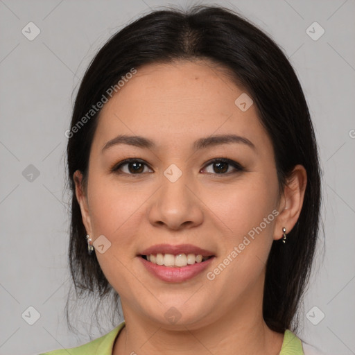 Joyful latino young-adult female with medium  brown hair and brown eyes