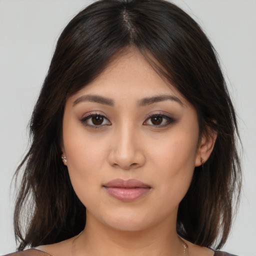 Joyful white young-adult female with medium  brown hair and brown eyes