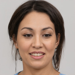 Joyful asian young-adult female with medium  brown hair and brown eyes