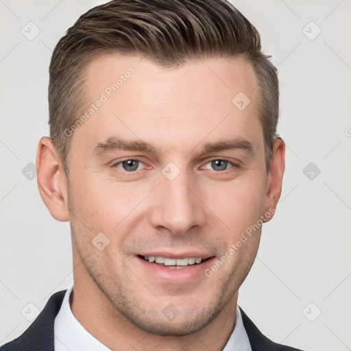 Joyful white young-adult male with short  brown hair and grey eyes