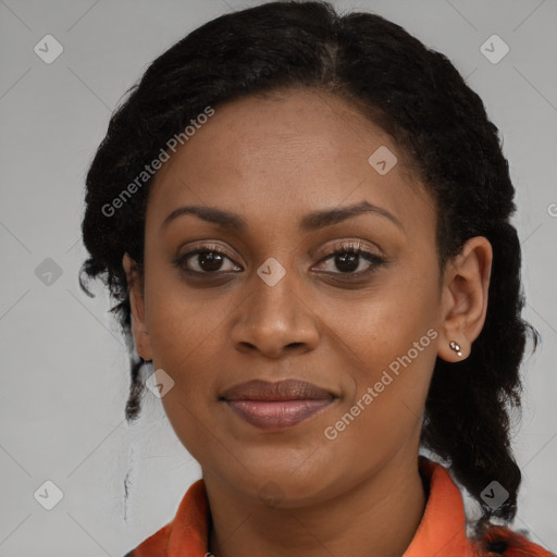 Joyful black young-adult female with long  brown hair and brown eyes