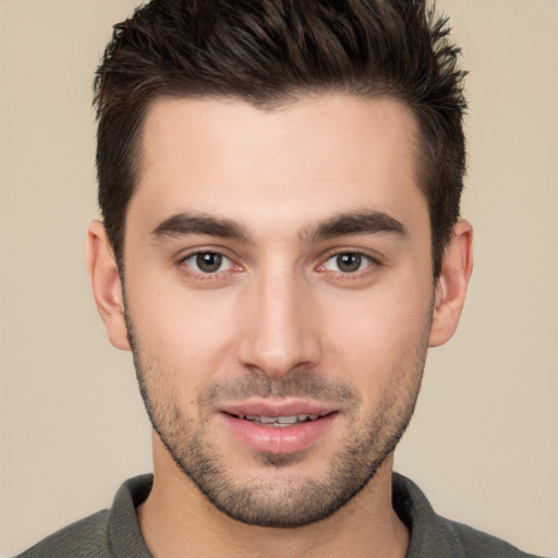 Joyful white young-adult male with short  brown hair and brown eyes