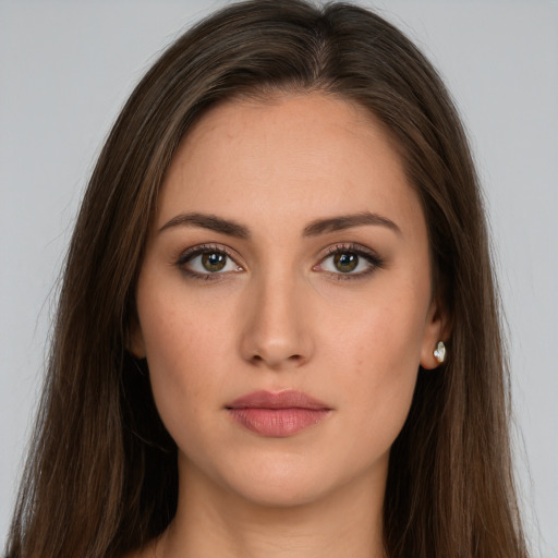 Neutral white young-adult female with long  brown hair and brown eyes