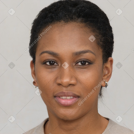 Joyful black young-adult female with short  black hair and brown eyes