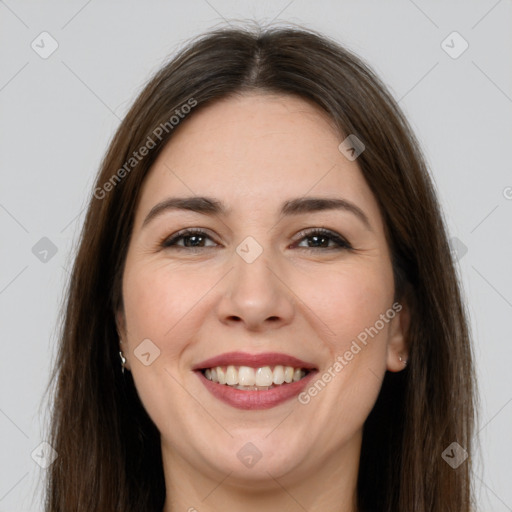 Joyful white young-adult female with long  brown hair and brown eyes