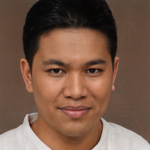 Joyful asian young-adult male with short  brown hair and brown eyes