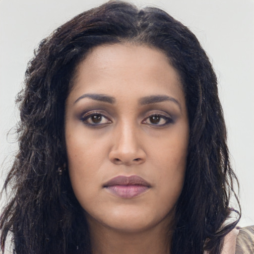 Neutral latino young-adult female with long  black hair and brown eyes