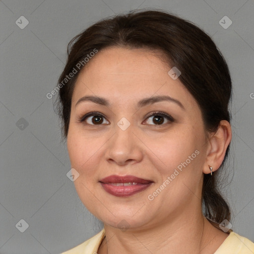 Joyful white adult female with medium  brown hair and brown eyes