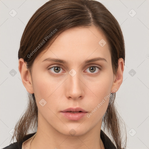 Neutral white young-adult female with long  brown hair and brown eyes