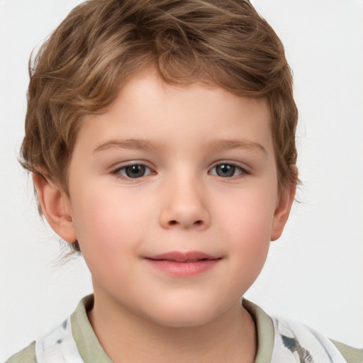 Joyful white child male with short  brown hair and brown eyes