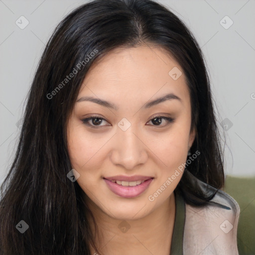 Joyful asian young-adult female with long  brown hair and brown eyes