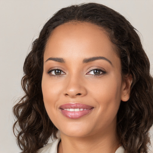 Joyful white young-adult female with long  brown hair and brown eyes