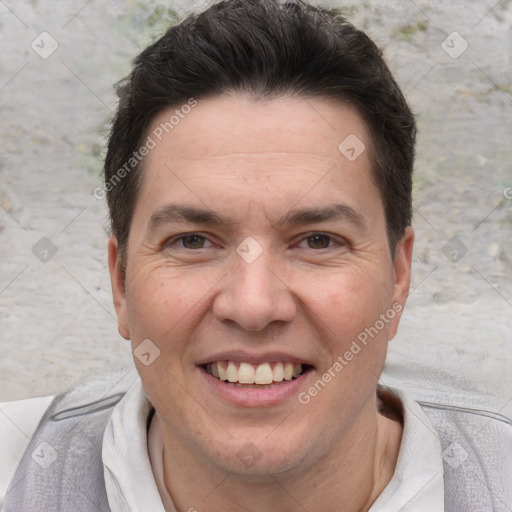 Joyful white adult male with short  brown hair and brown eyes