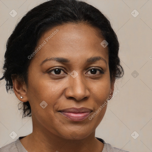 Joyful black adult female with medium  brown hair and brown eyes