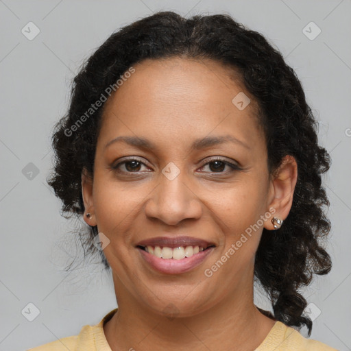 Joyful latino adult female with medium  brown hair and brown eyes