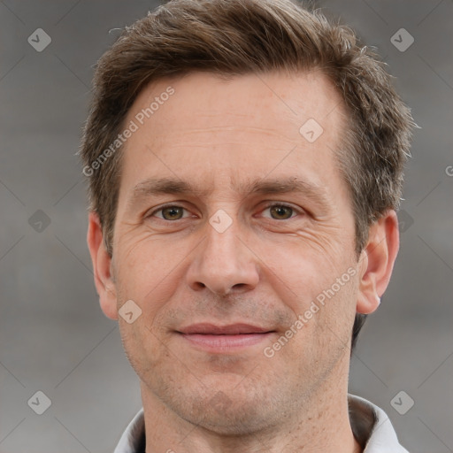 Joyful white adult male with short  brown hair and grey eyes