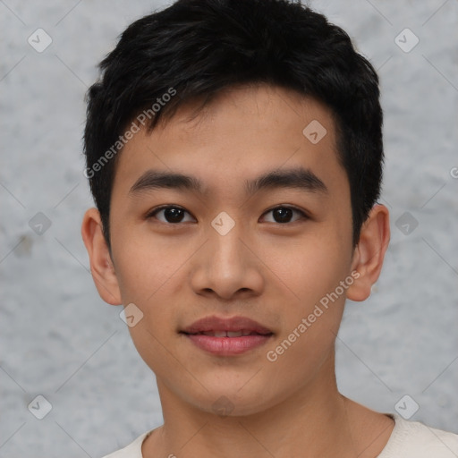 Joyful asian young-adult male with short  black hair and brown eyes