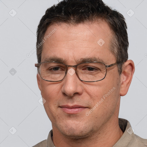 Joyful white adult male with short  brown hair and brown eyes