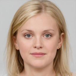 Joyful white young-adult female with medium  brown hair and blue eyes