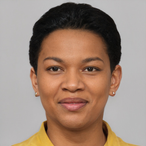 Joyful latino young-adult female with short  black hair and brown eyes